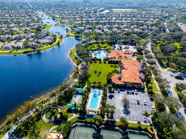 an aerial view of a houses with a lake view
