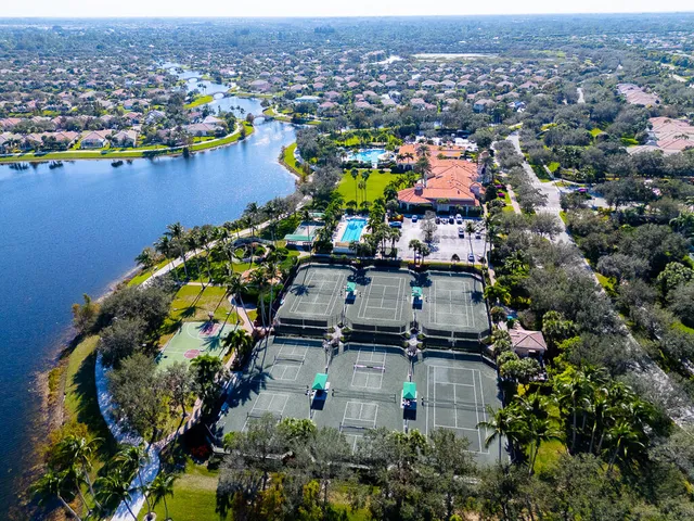 an aerial view of a house with a swimming pool yard and outdoor seating