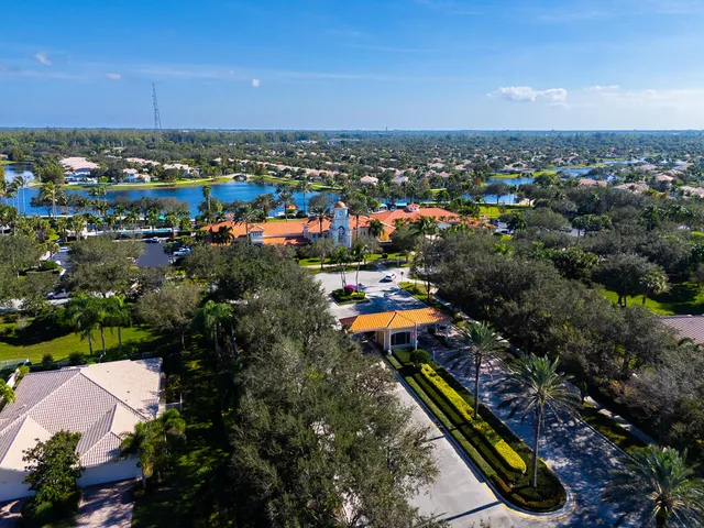 a view of a garden with a house in the background