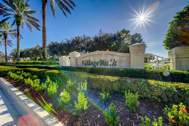 a view of a garden with an umbrella and potted plants