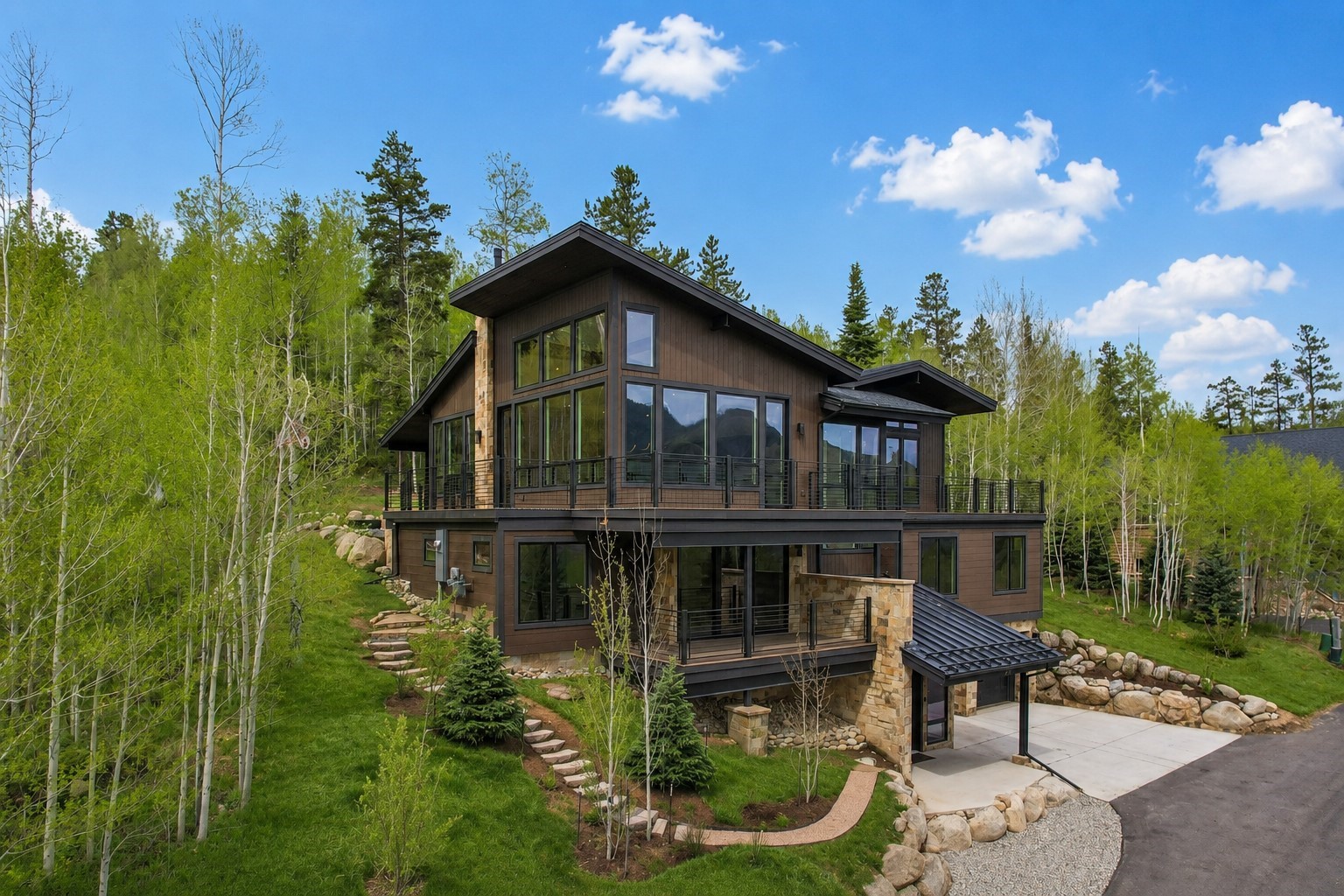 1325 Golden Eagle Road Silverthorne, CO 80498 - Photo 43 of 46 a front view of a house with a yard