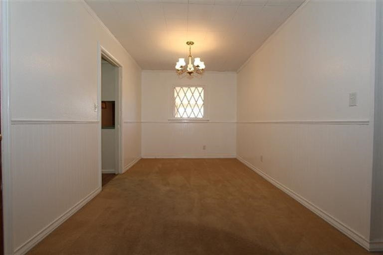 3004 36th Street Lubbock, TX 79413 - Photo 4 of 10 an empty room that has a window in it
