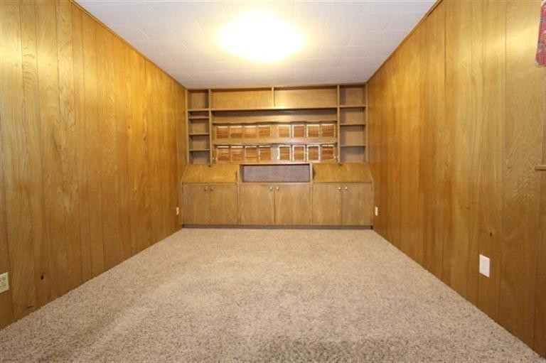 3004 36th Street Lubbock, TX 79413 - Photo 9 of 10 a view of a room with wooden walls