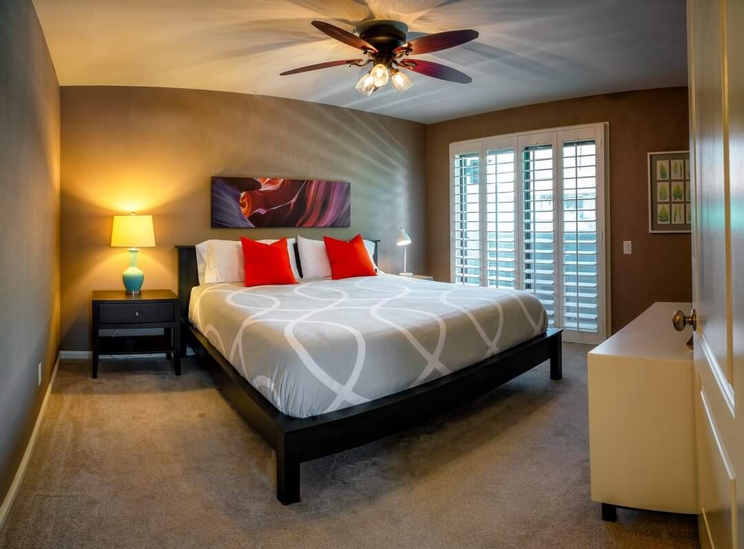 351 North Hermosa Drive, Unit 2A2 Palm Springs, CA 92262 - Photo 4 of 17 a bedroom with a bed and a couch