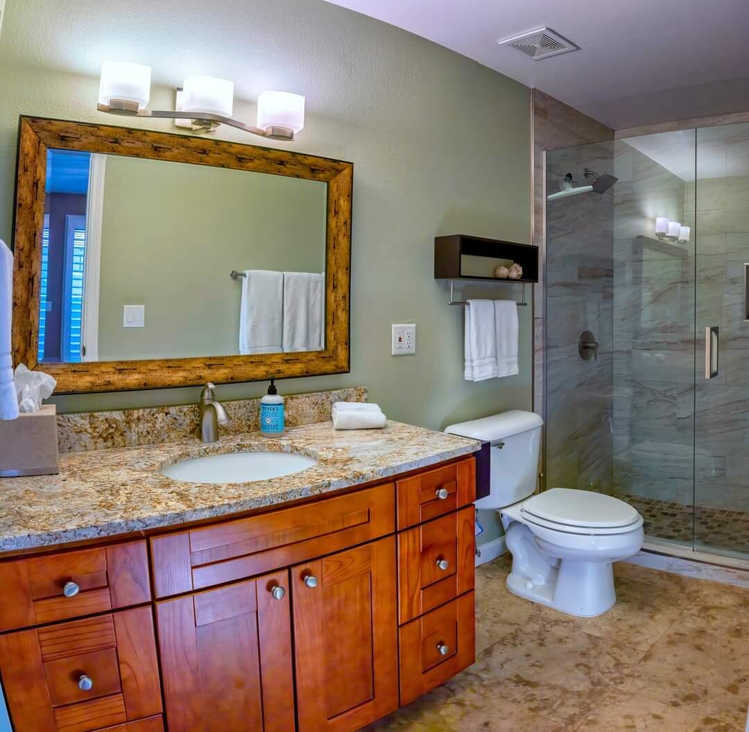 351 North Hermosa Drive, Unit 2A2 Palm Springs, CA 92262 - Photo 6 of 17 a bathroom with a granite countertop toilet sink and mirror