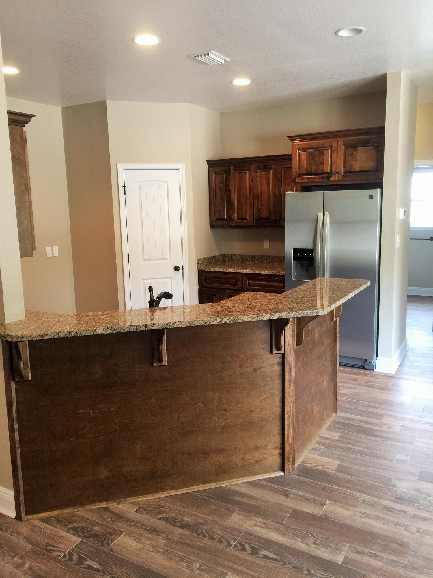 4011 Happy Trails Road Crestview, FL 32539 - Photo 15 of 19 a kitchen with stainless steel appliances granite countertop a sink and a refrigerator