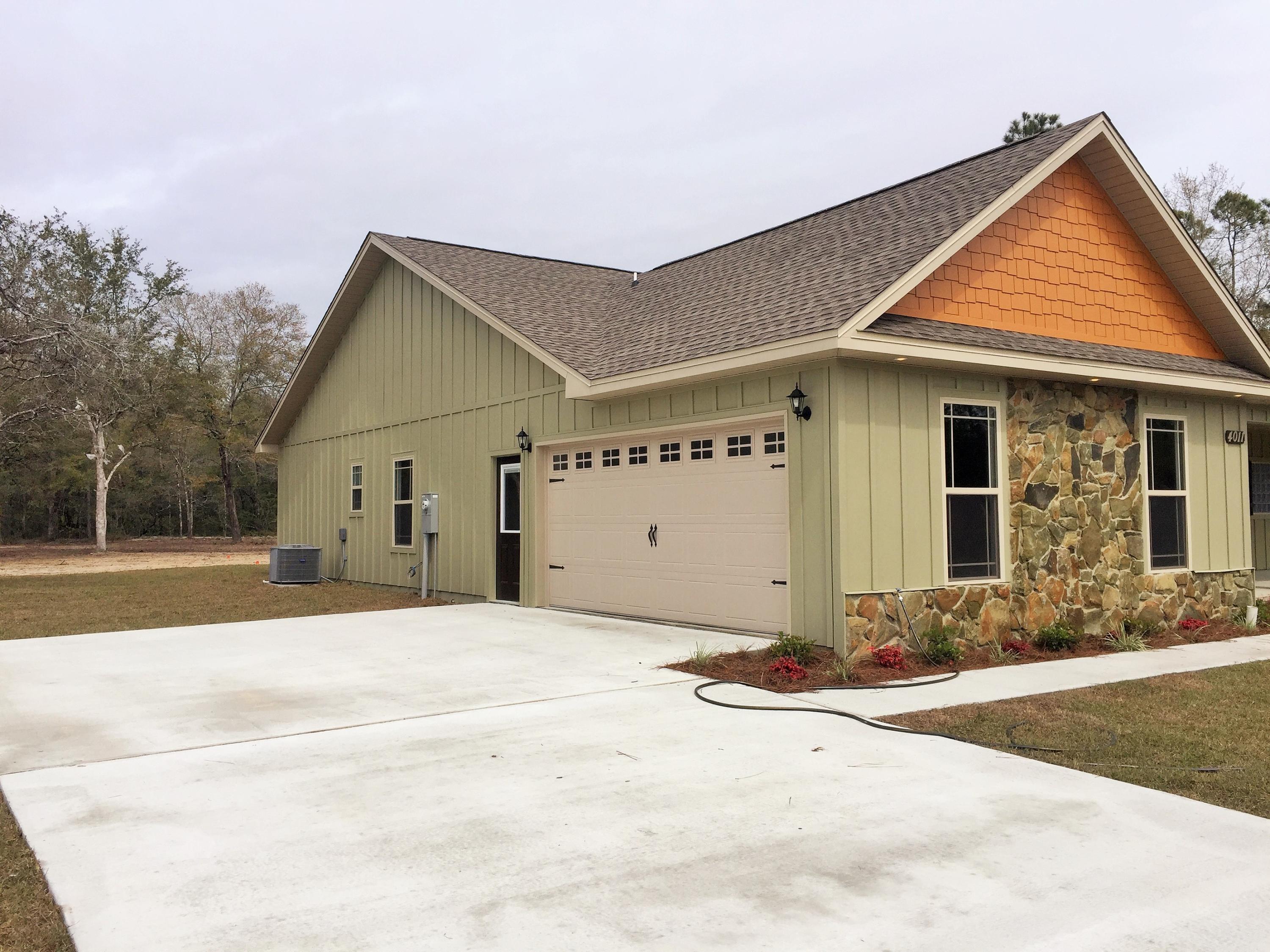 4011 Happy Trails Road Crestview, FL 32539 - Photo 3 of 19 a view of a house with a yard