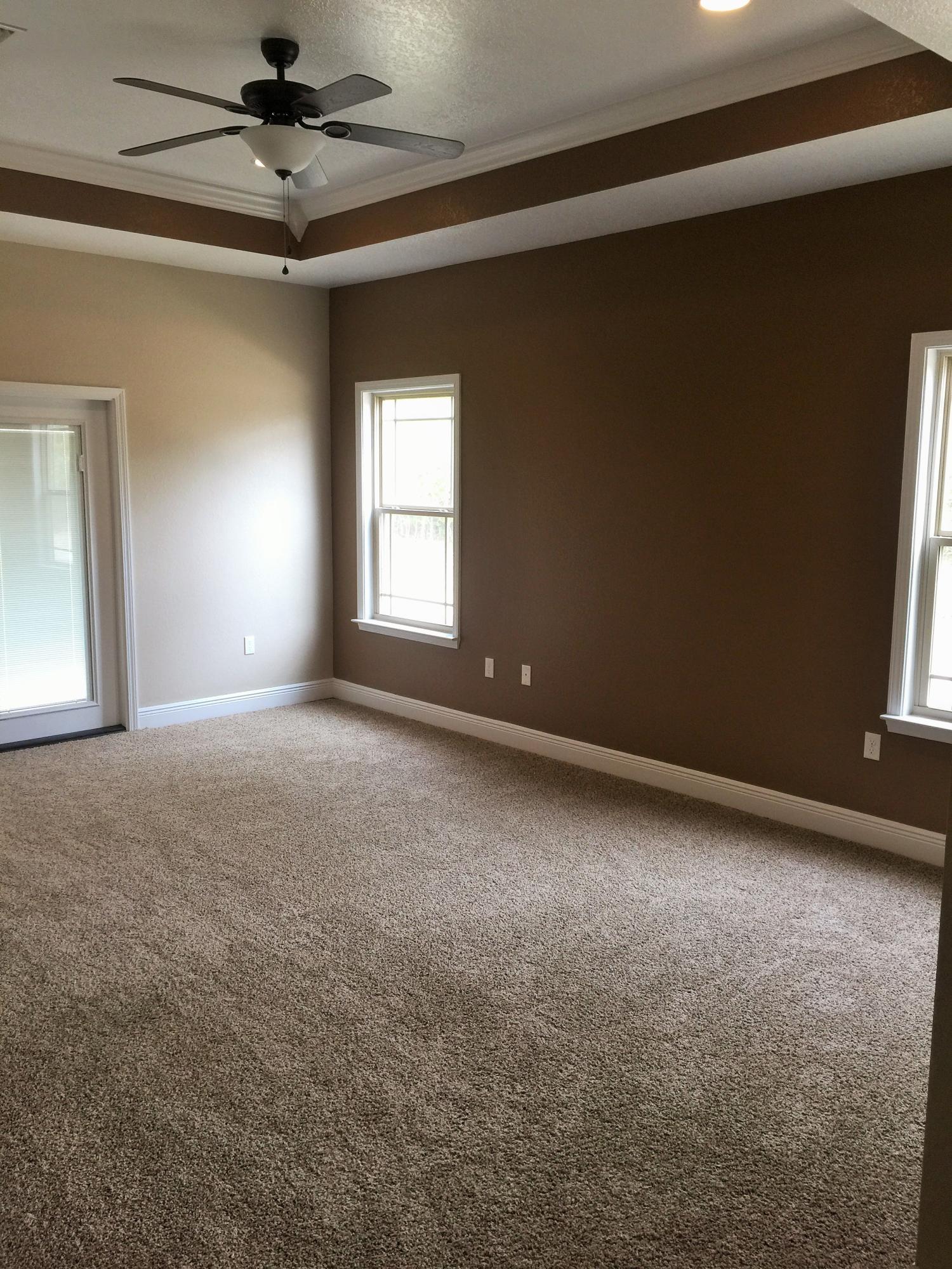 4011 Happy Trails Road Crestview, FL 32539 - Photo 6 of 19 en empty room with windows and fan