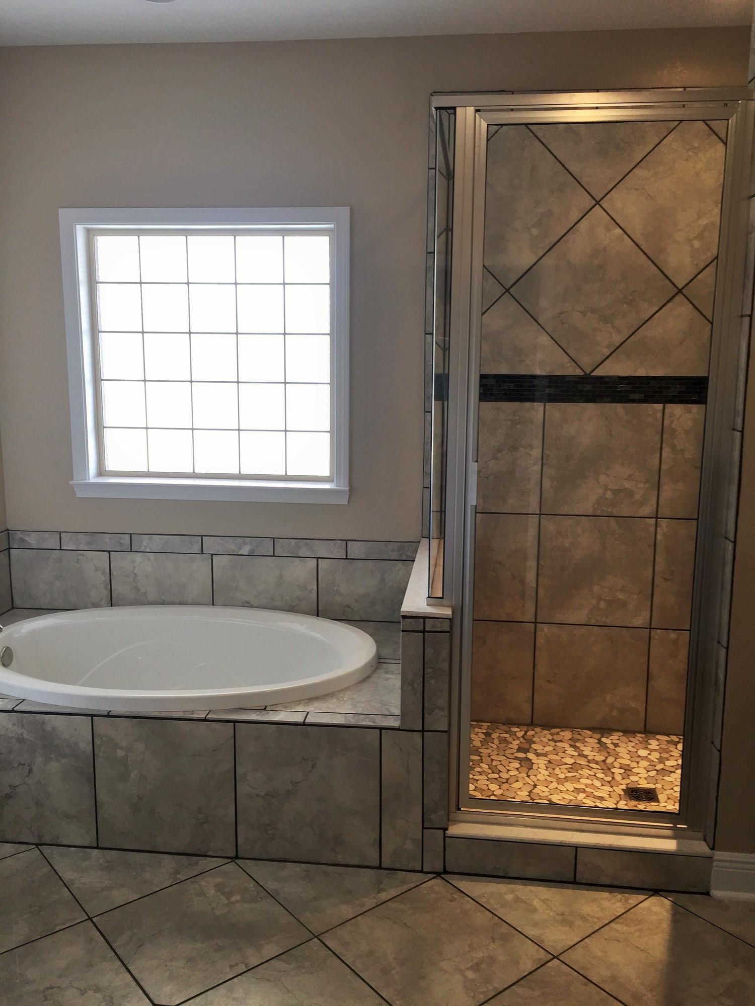 4011 Happy Trails Road Crestview, FL 32539 - Photo 8 of 19 a bathroom with a bathtub and shower