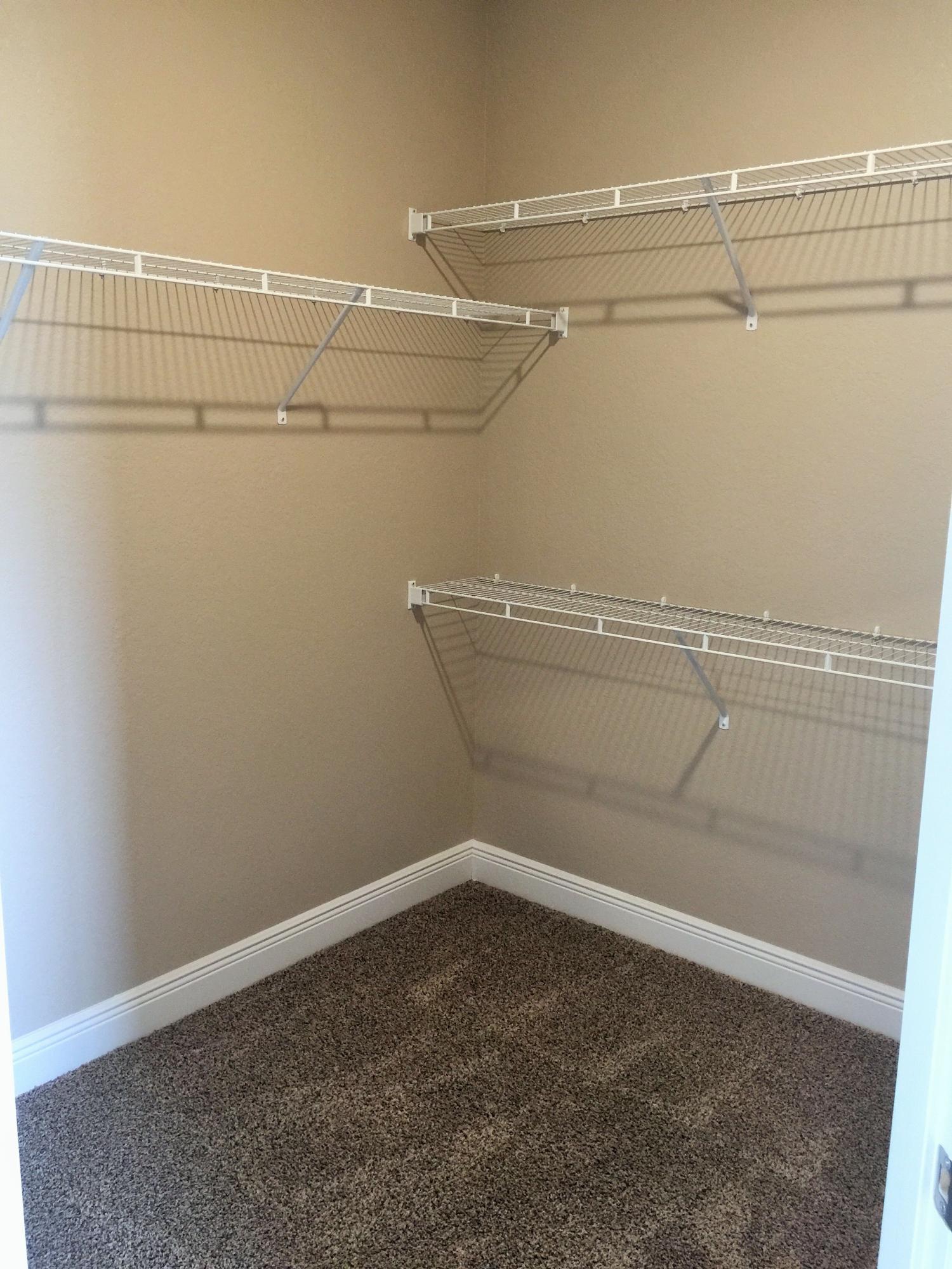 4011 Happy Trails Road Crestview, FL 32539 - Photo 9 of 19 a view of a room with racks on the wall