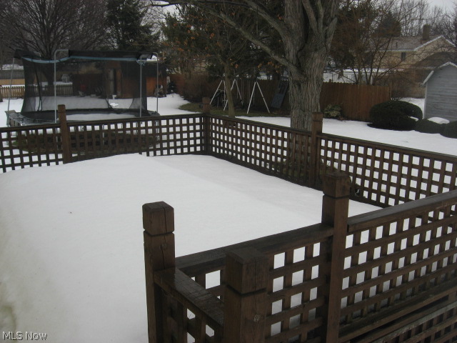 Super custom deck off kitchen excellent for entertaining and gatherings. Overlooks backyard