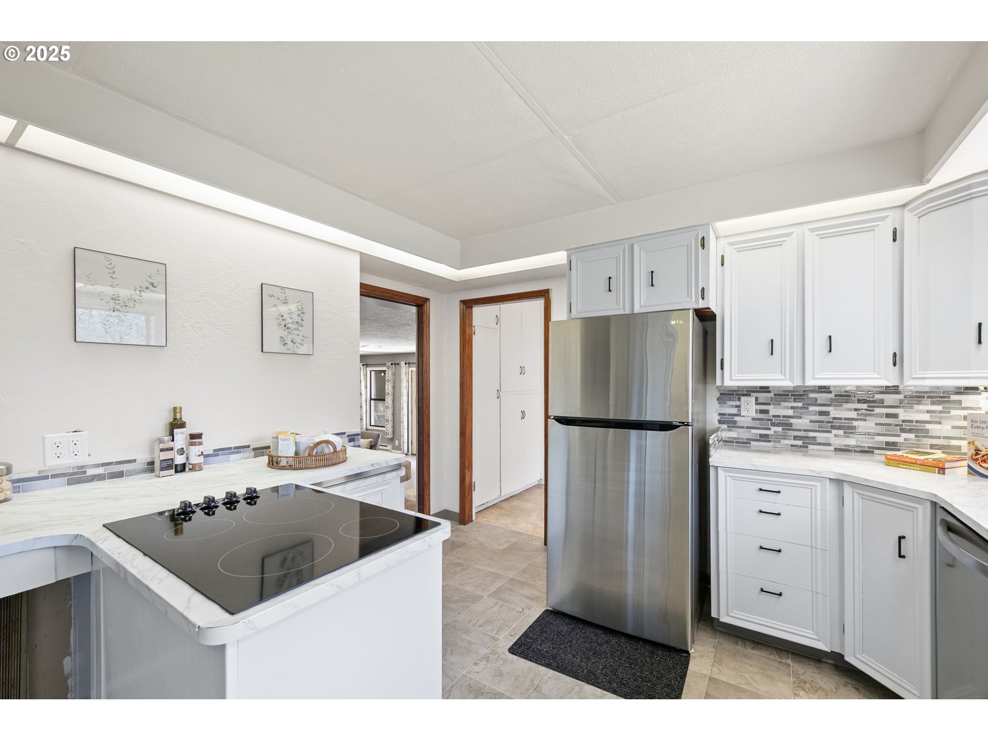 325 Water Street Springfield, OR 97477 - Photo 15 of 48 a kitchen with a sink a stove a refrigerator and white cabinets