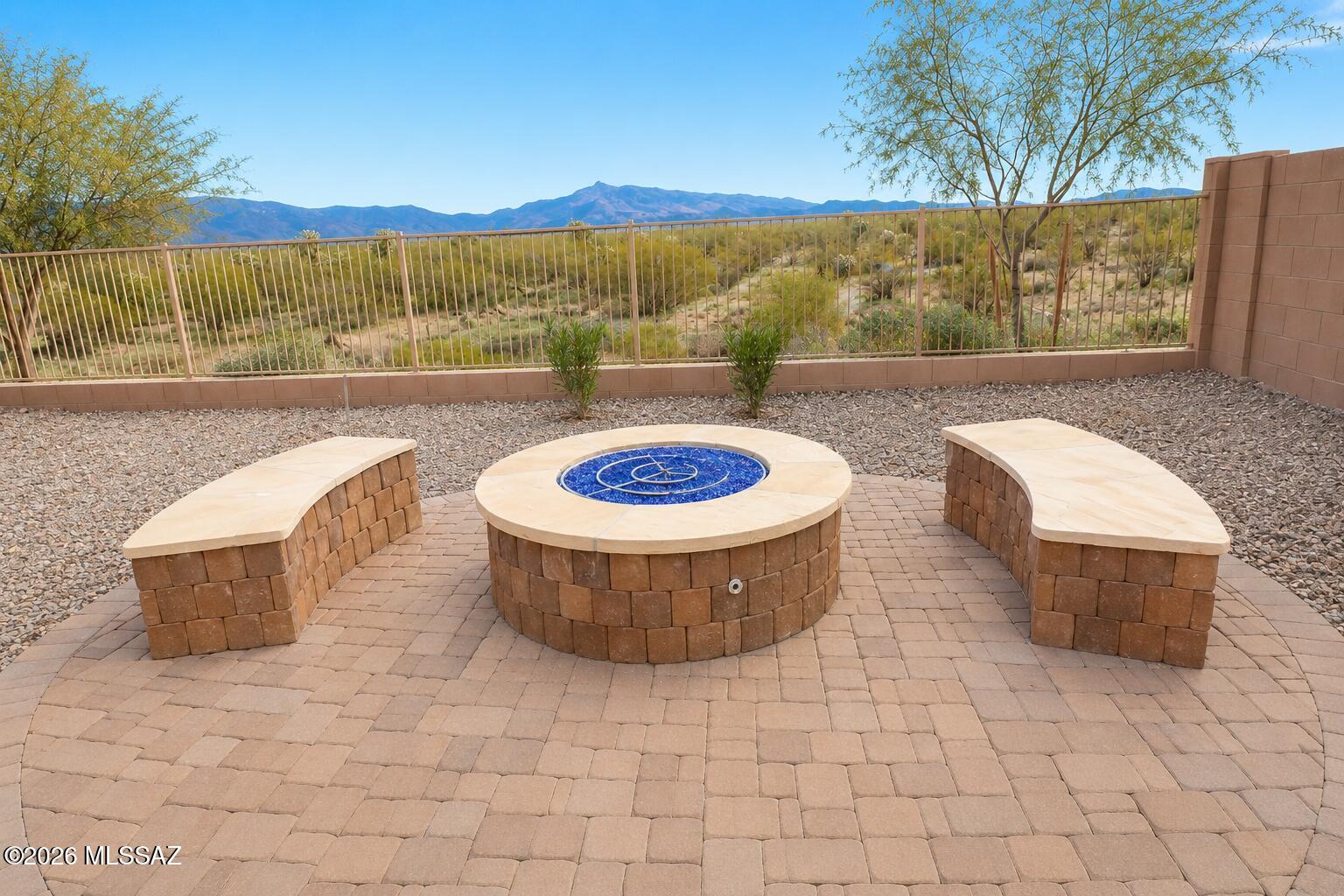 11484 East Desert Raptor Loop Tucson, AZ 85747 - Photo 1 of 28 a view of a swimming pool with a patio and a yard