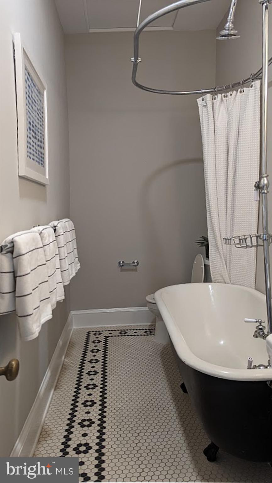 633 A Street Northeast Washington, DC 20002 - Photo 32 of 56 Second bath with antique tub, pedestal sink.