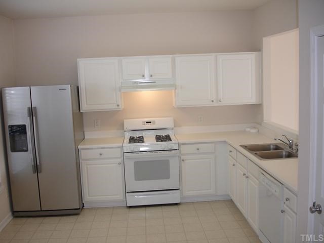 4325 Vienna Crest Drive Raleigh, NC 27613 - Photo 3 of 12 a kitchen with cabinets appliances and a sink