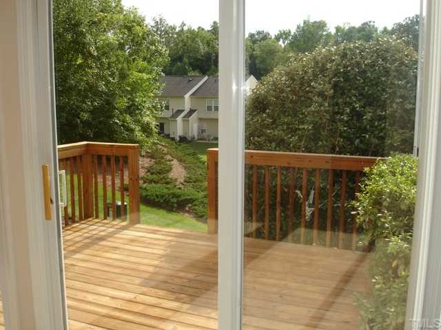 4325 Vienna Crest Drive Raleigh, NC 27613 - Photo 5 of 12 a view of balcony with wooden floor and fence