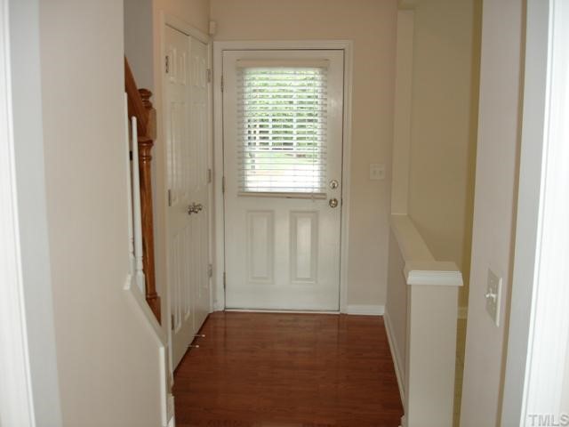 4325 Vienna Crest Drive Raleigh, NC 27613 - Photo 9 of 12 a view of hallway with closet and wooden floor
