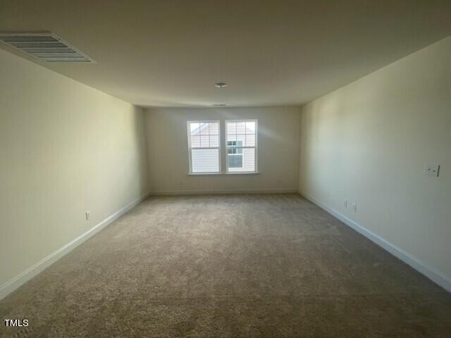 912 Channel Drop Loop Zebulon, NC 27597 - Photo 14 of 25 an empty room with a window