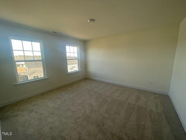 912 Channel Drop Loop Zebulon, NC 27597 - Photo 15 of 25 an empty room with windows