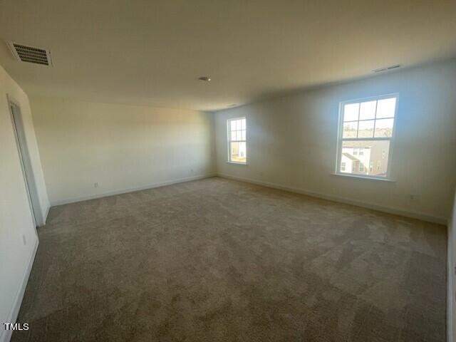 912 Channel Drop Loop Zebulon, NC 27597 - Photo 16 of 25 an empty room with a windows and closet