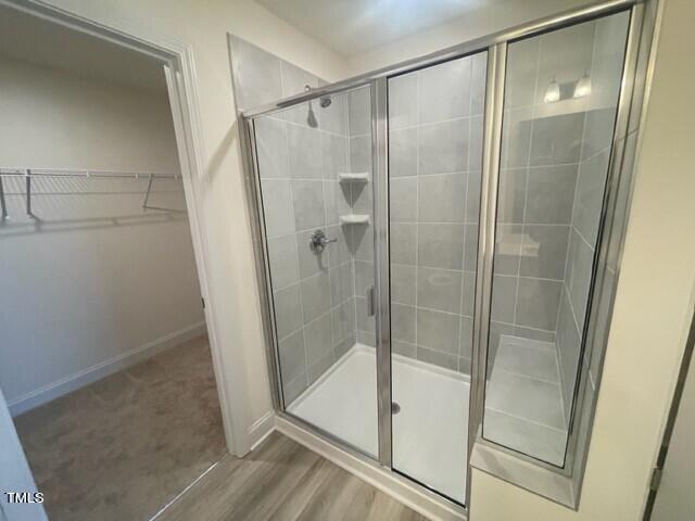 912 Channel Drop Loop Zebulon, NC 27597 - Photo 18 of 25 a bathroom with a glass shower door