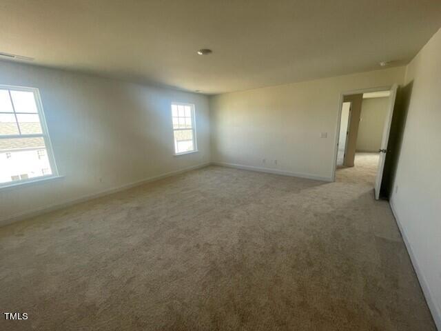 912 Channel Drop Loop Zebulon, NC 27597 - Photo 20 of 25 an empty room with windows