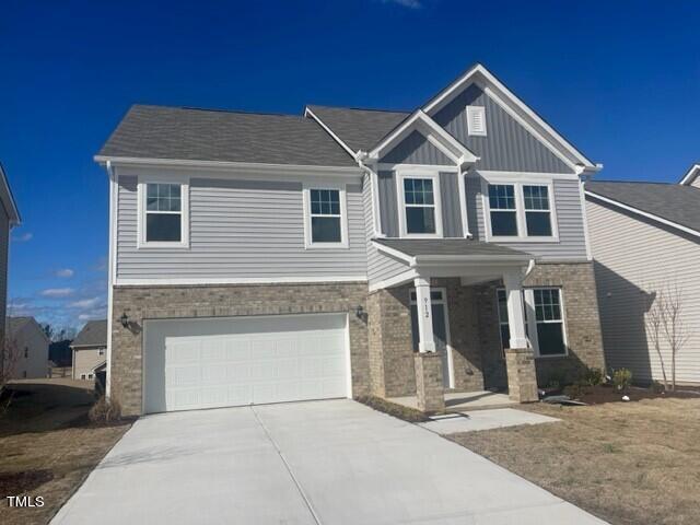 912 Channel Drop Loop Zebulon, NC 27597 - Photo 2 of 25 a front view of a house with garage
