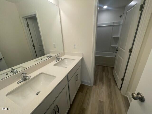 912 Channel Drop Loop Zebulon, NC 27597 - Photo 22 of 25 a spacious bathroom with a double vanity sink and mirror