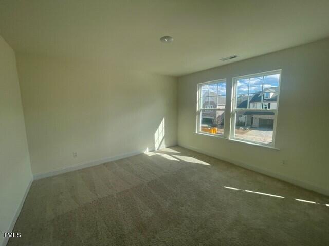 912 Channel Drop Loop Zebulon, NC 27597 - Photo 23 of 25 a view of an empty room with a window
