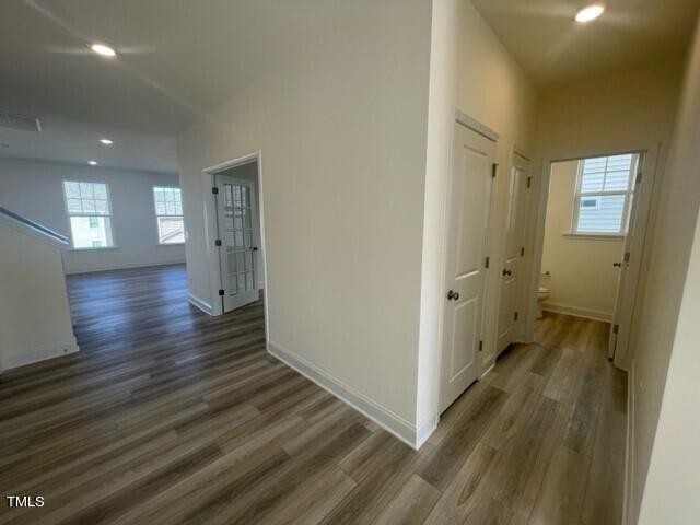 912 Channel Drop Loop Zebulon, NC 27597 - Photo 5 of 25 a view of a hallway with wooden floor