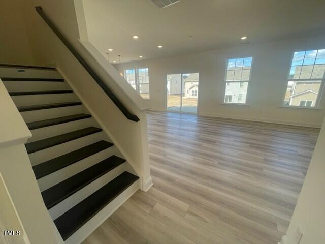 912 Channel Drop Loop Zebulon, NC 27597 - Photo 7 of 25 a view of entryway with wooden floor and stairs