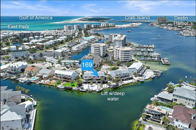 an aerial view of a house with a ocean view