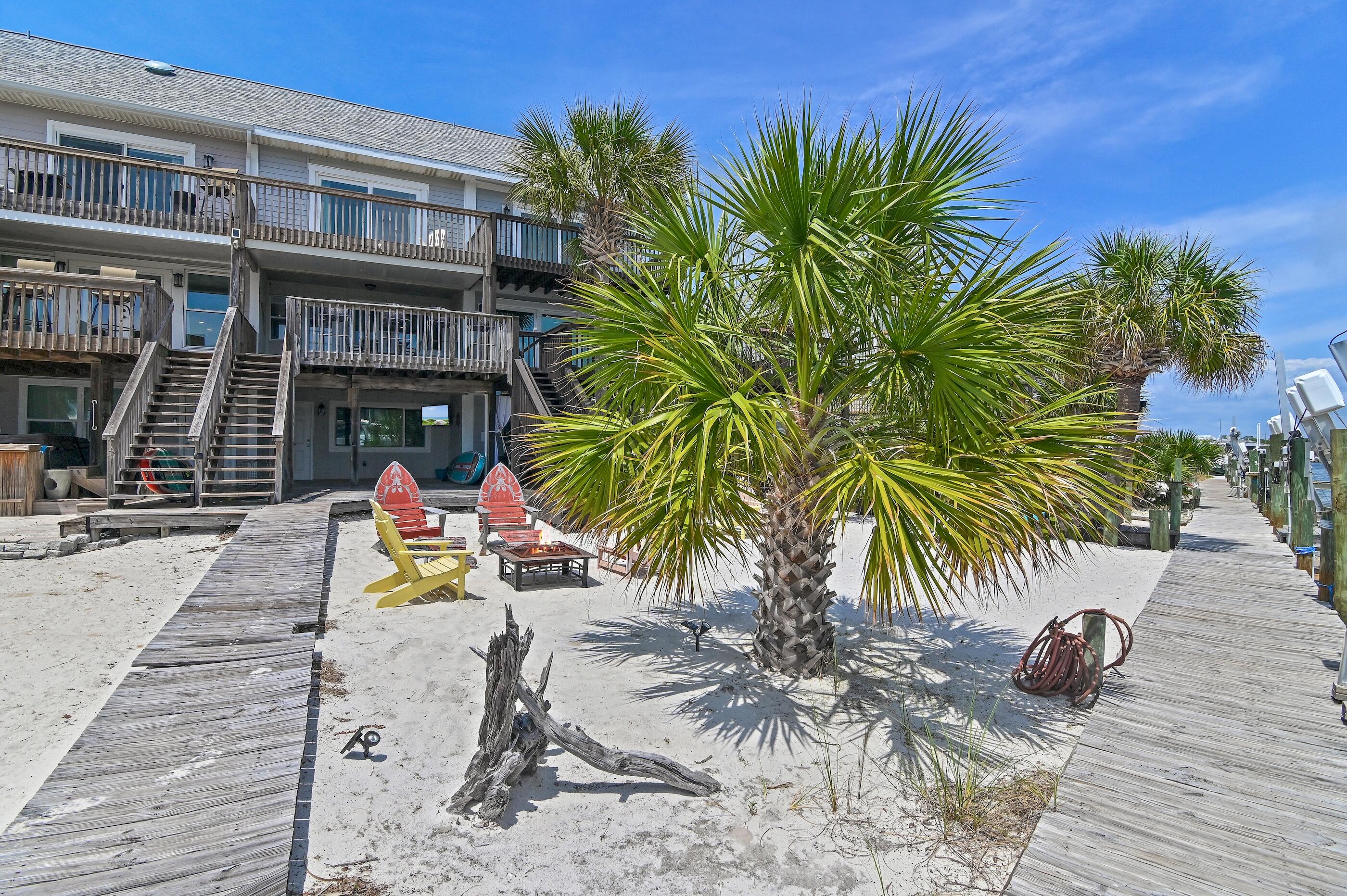 169 Durango Road Destin, FL 32541 - Photo 16 of 39 a view of a backyard with a patio and swimming pool