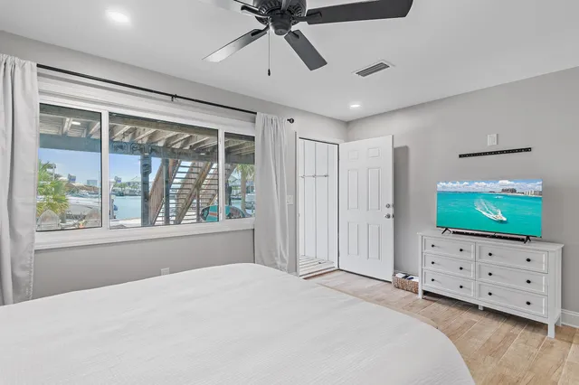 a bedroom with furniture and a flat screen tv