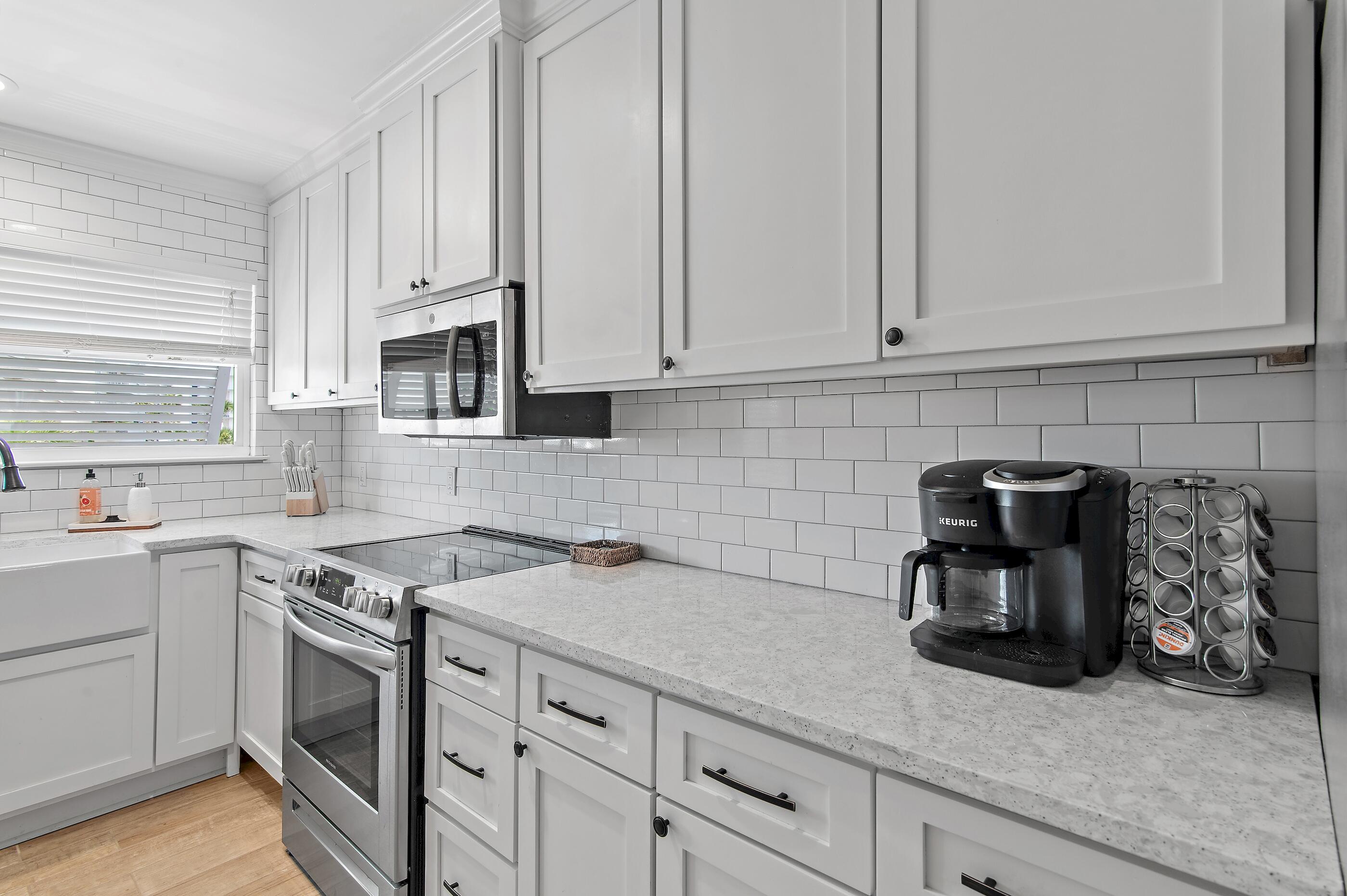 169 Durango Road Destin, FL 32541 - Photo 22 of 39 a kitchen with appliances a sink and cabinets