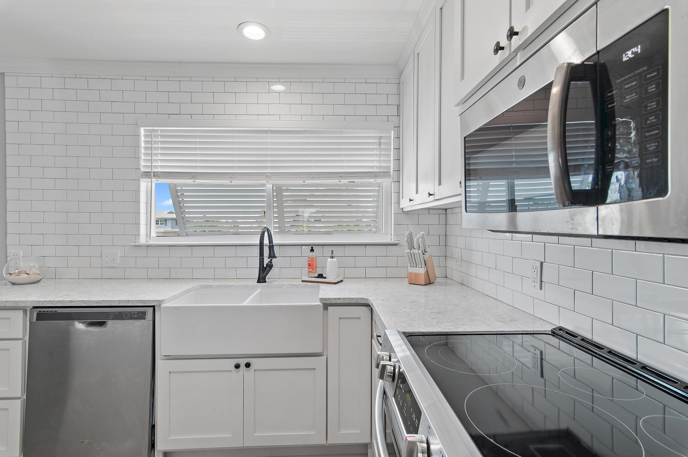 169 Durango Road Destin, FL 32541 - Photo 23 of 39 a kitchen with a sink cabinets and window