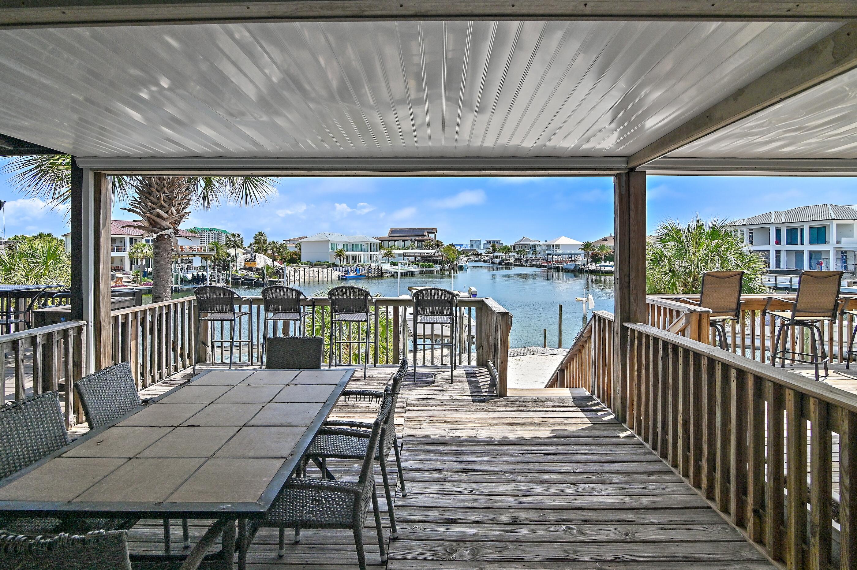 169 Durango Road Destin, FL 32541 - Photo 26 of 39 a view of a balcony with wooden chairs