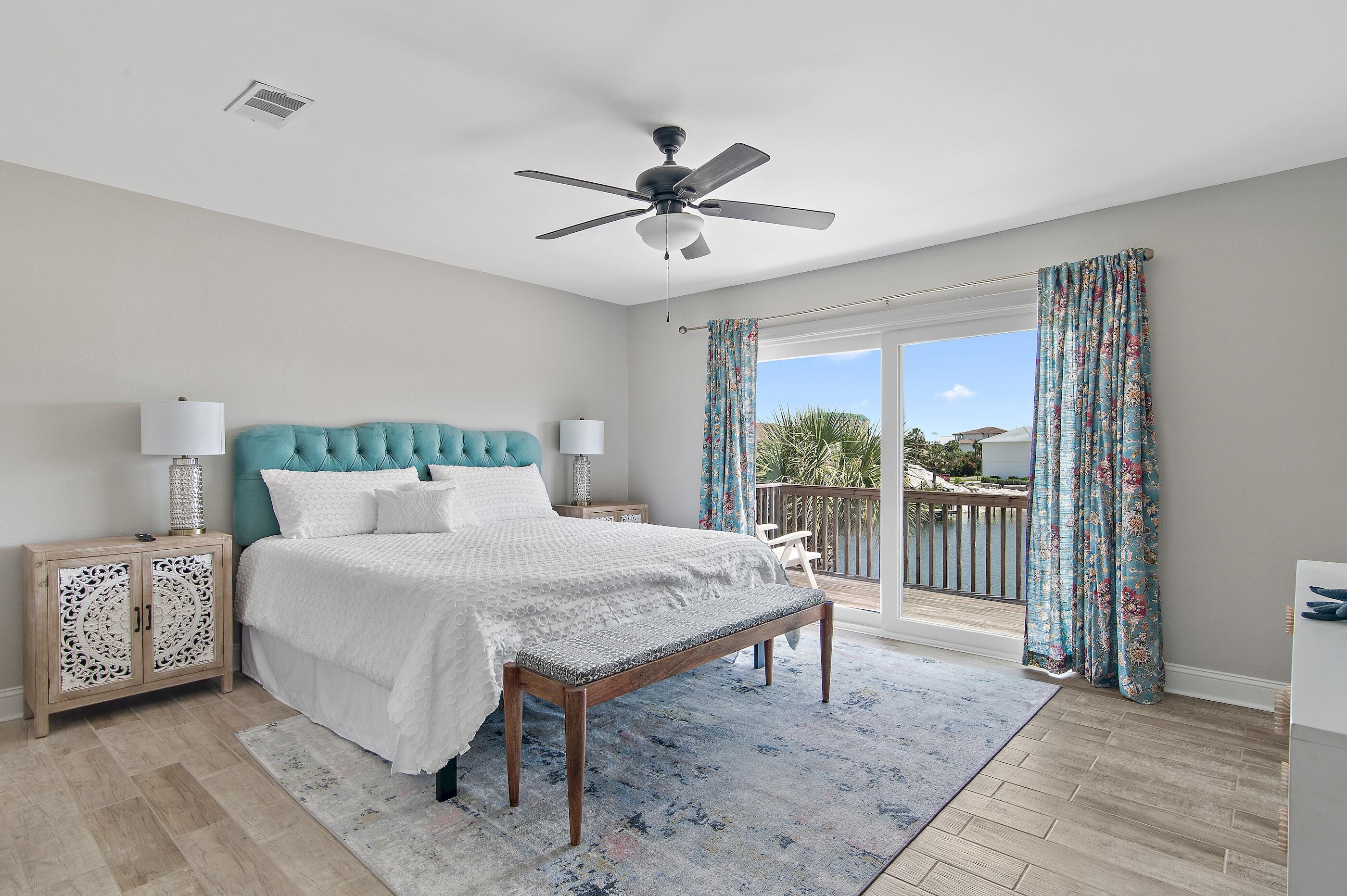 169 Durango Road Destin, FL 32541 - Photo 27 of 39 a bedroom with a bed and a table