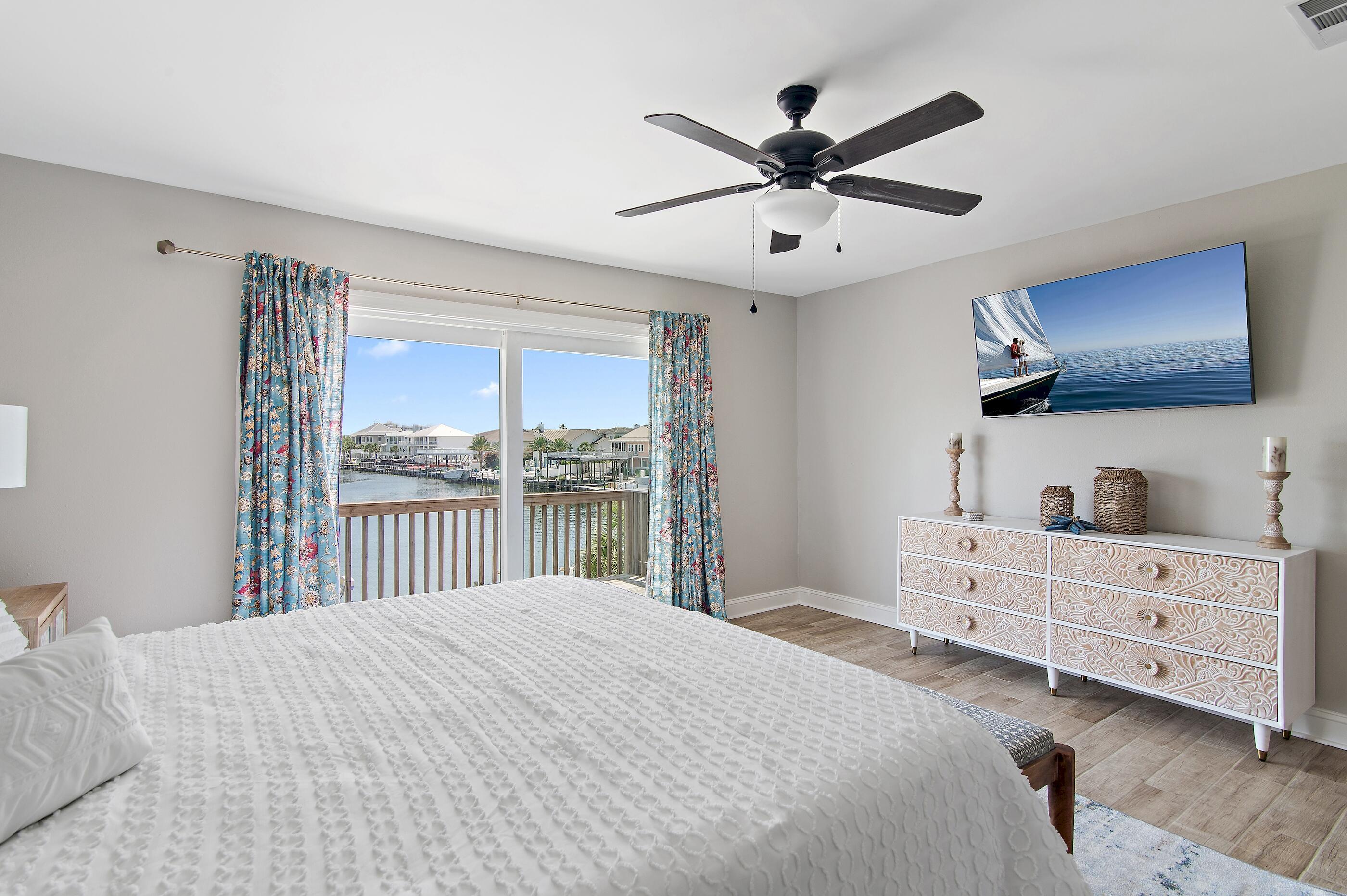 169 Durango Road Destin, FL 32541 - Photo 28 of 39 a bedroom with a large bed and a window