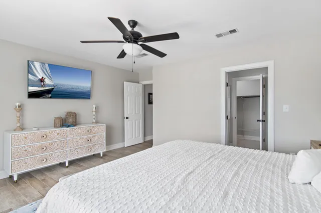 a bedroom with a bed and a dresser