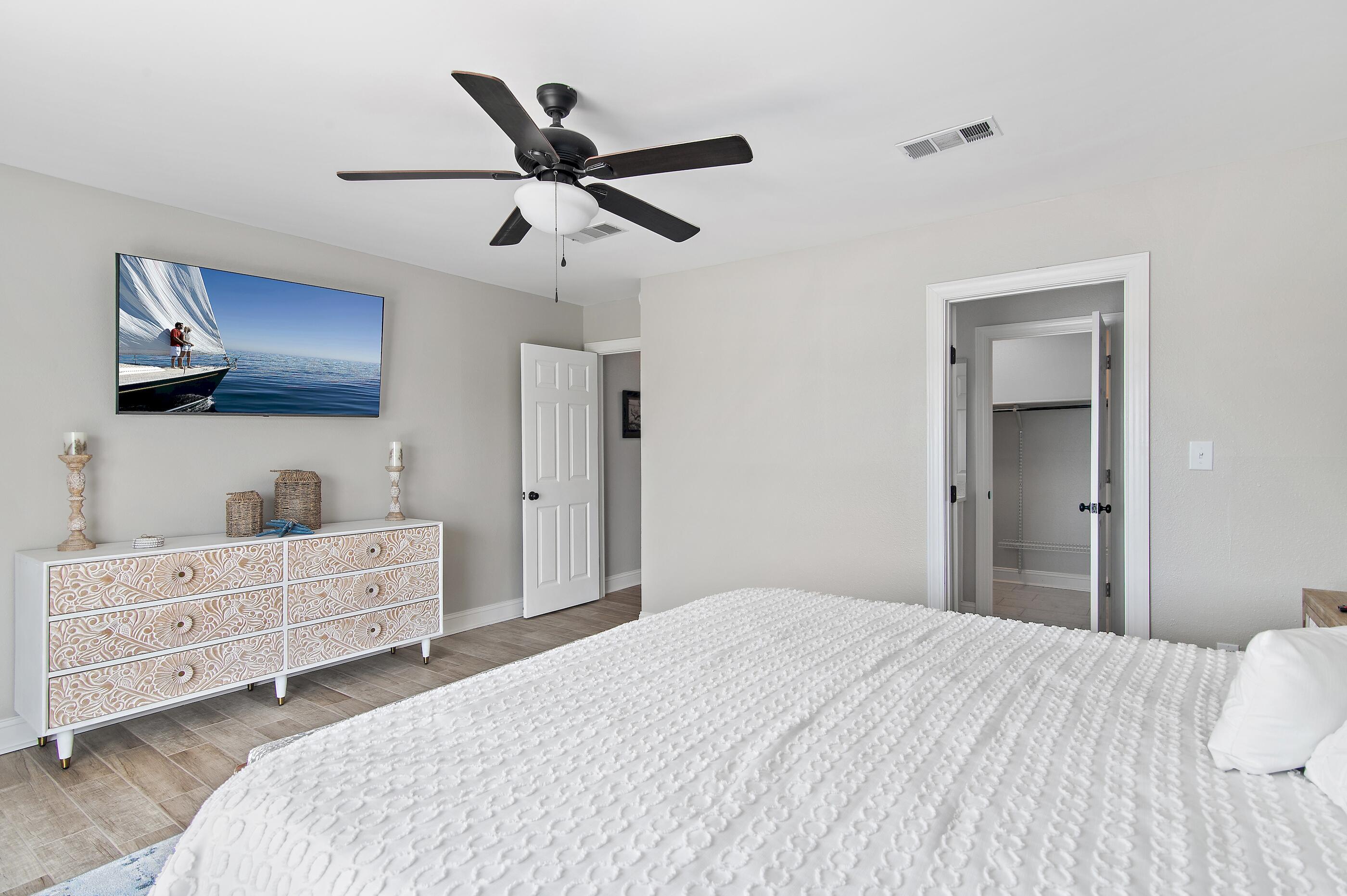 169 Durango Road Destin, FL 32541 - Photo 29 of 39 a bedroom with a bed and a dresser