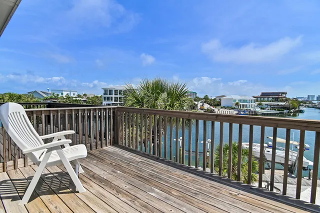 a view of a balcony with wooden floor and city view