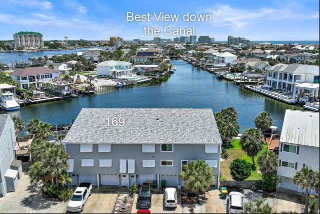 an aerial view of a house with a lake view
