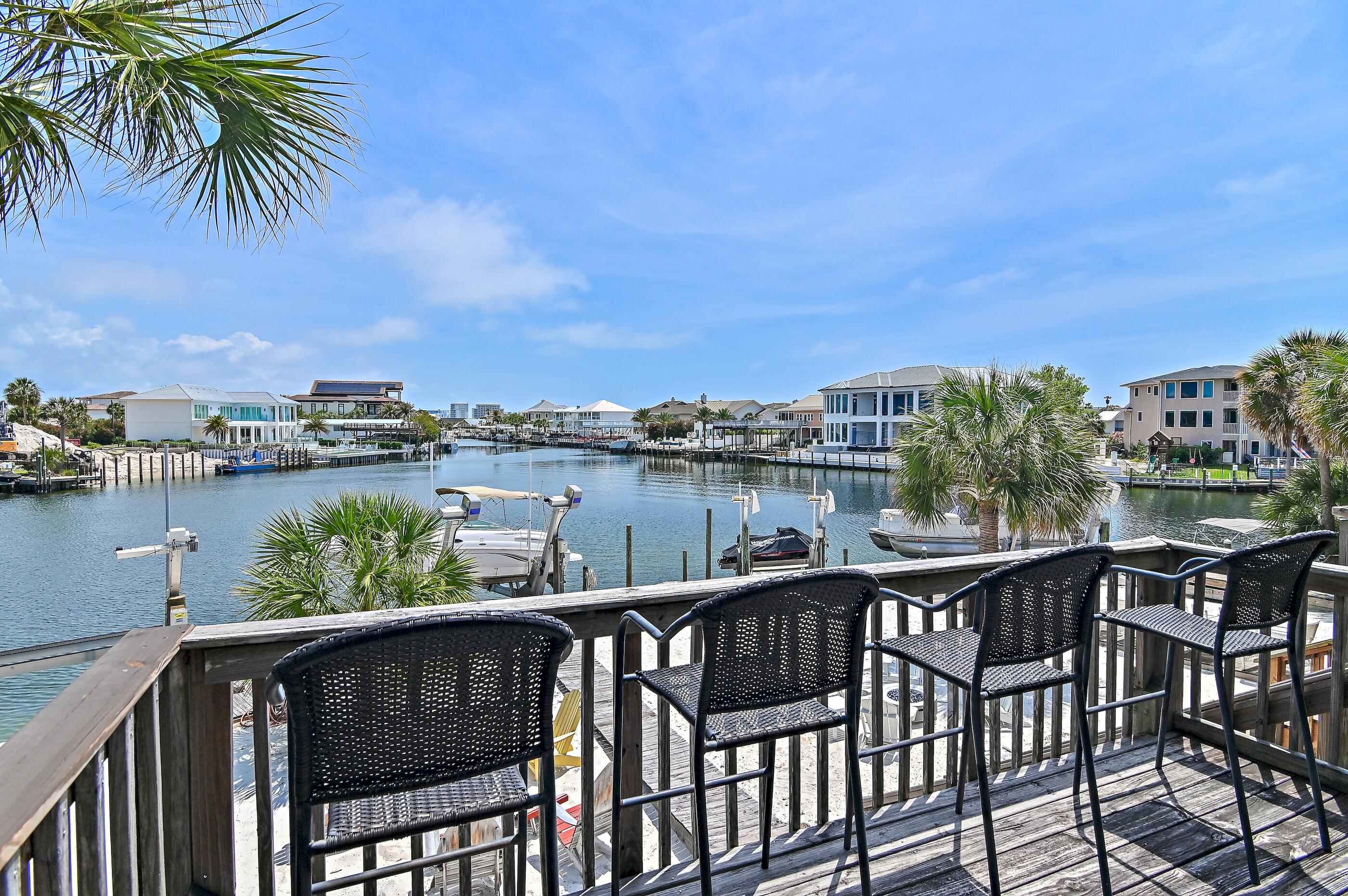 169 Durango Road Destin, FL 32541 - Photo 4 of 39 a view of a lake from a balcony with outdoor seating