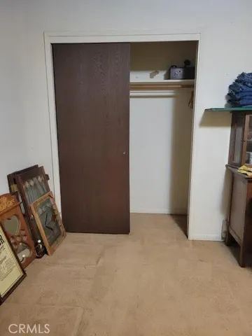 a couple of table and chairs under an umbrella