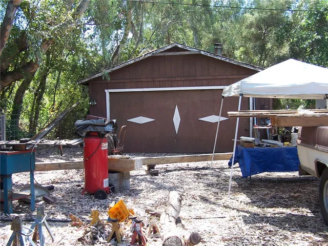 a view of a tree with a yard