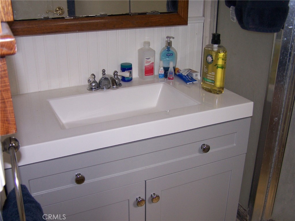7136 Upper Palermo Road Palermo, CA 95968 - Photo 10 of 26 a bathroom with a sink and a mirror