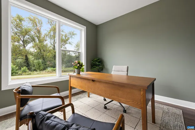 a workspace with furniture and a window