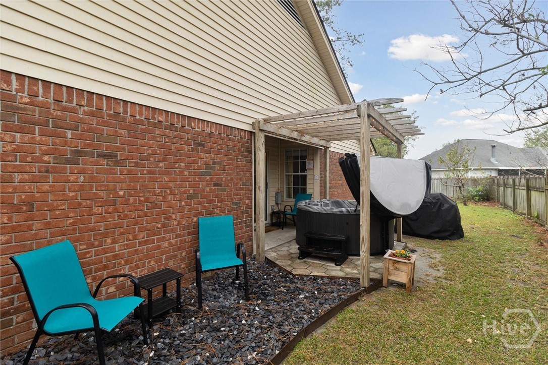 117 Longleaf Circle Pooler, GA 31322 - Photo 18 of 21 Side patio with hot tub