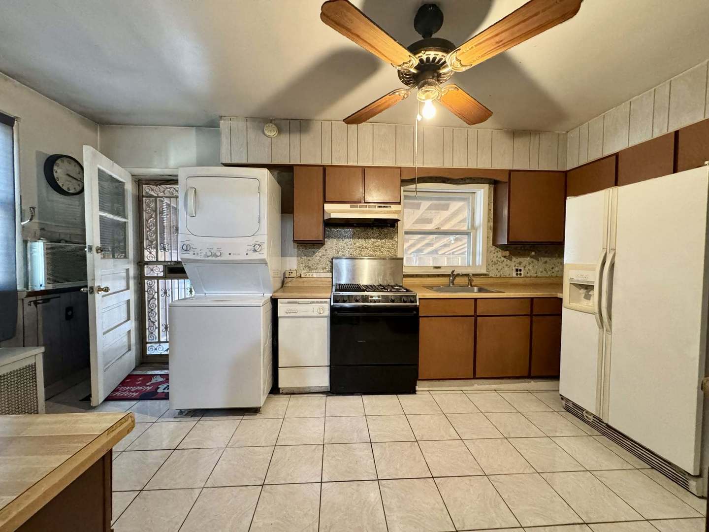 5437 North Linder Avenue Chicago, IL 60630 - Photo 13 of 28 a kitchen with a stove a refrigerator and a sink